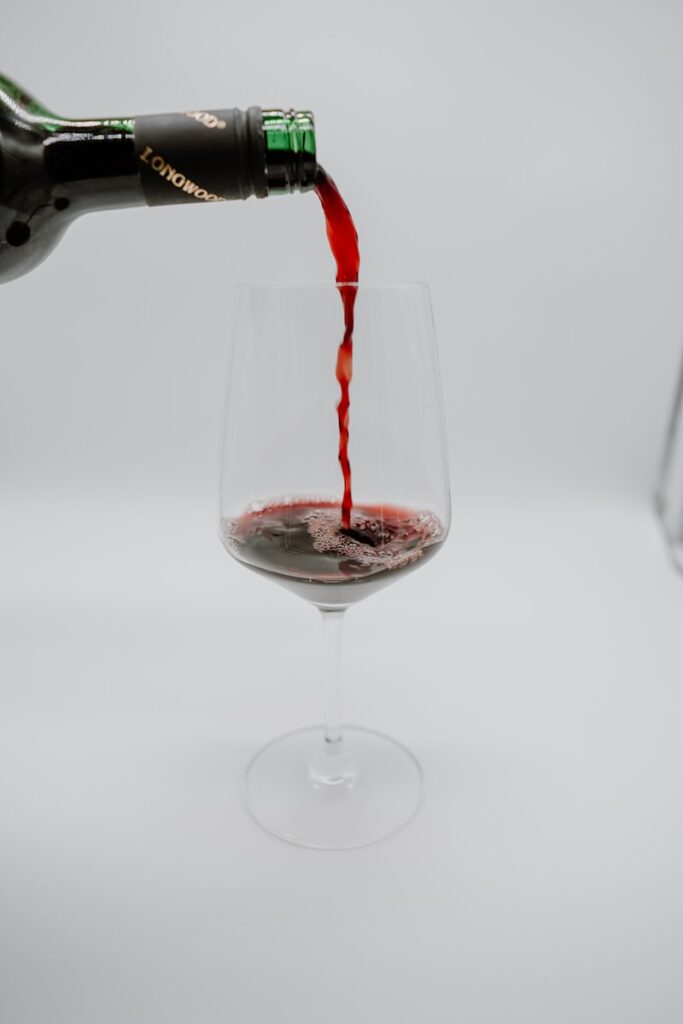 clear wine glass with red wine